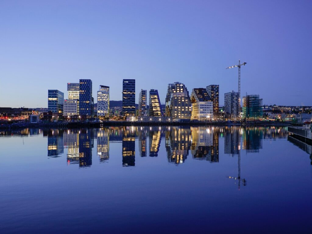 cityscape by water during golden hour